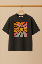 Ziaa's black t-shirt with colorful graphic design of golden hour