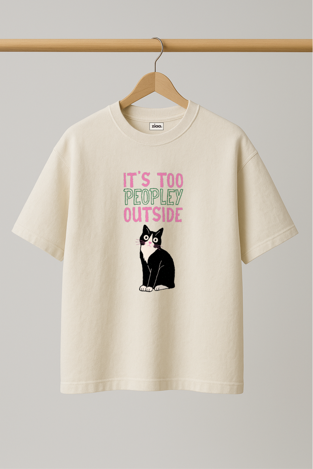 ZIAA "It's too poepley outside" graphic t-shirt with illustration of a cat, white color base with pink and black graphic