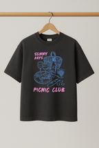 ZIAA "Sunny Days Picnic Club" graphic t-shirt with illustration of picnic items, dark grey color base with pink and blue graphic