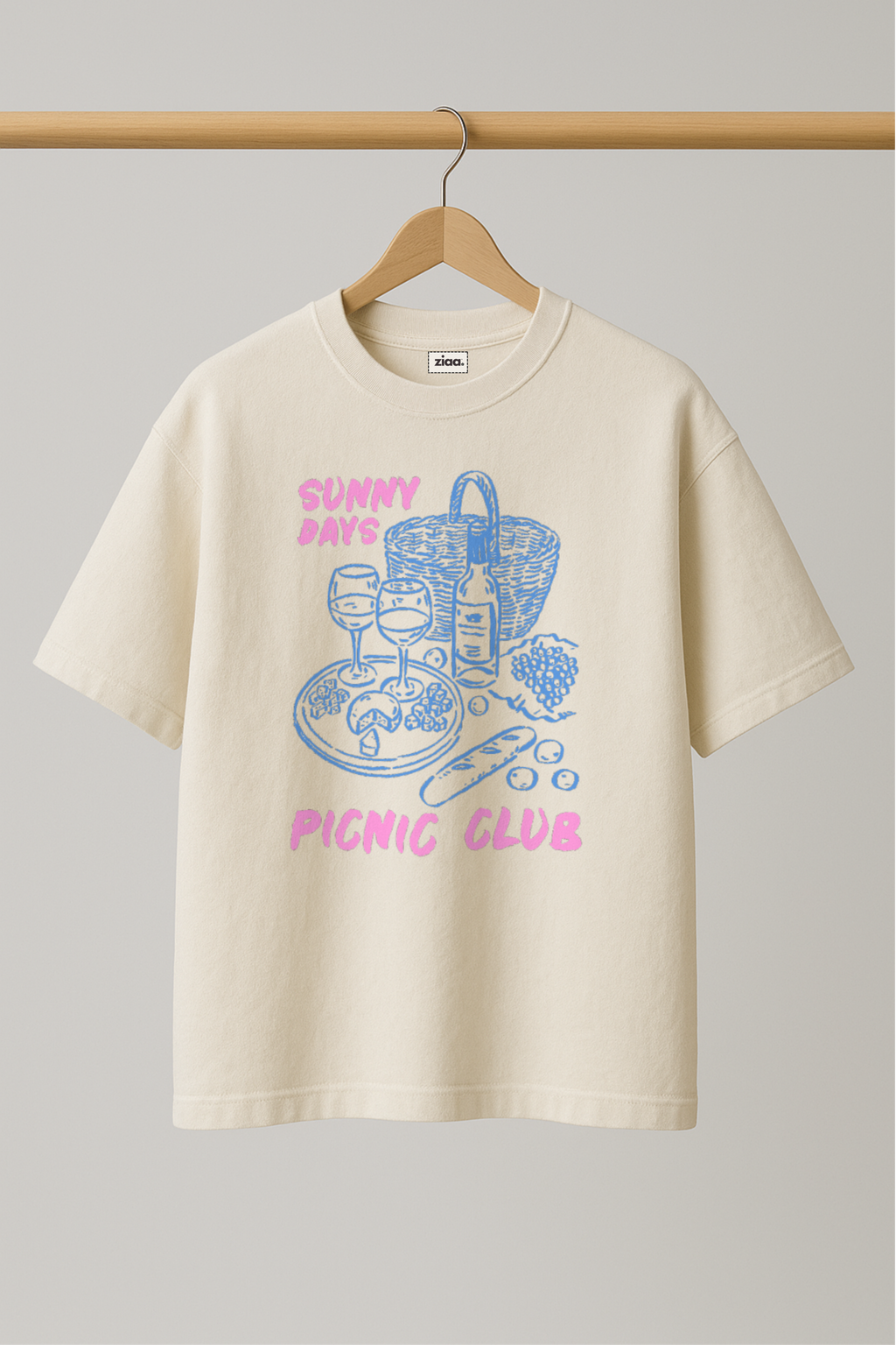 ZIAA "Sunny Days Picnic Club" graphic t-shirt with illustration of picnic items, white color base with pink and blue graphic