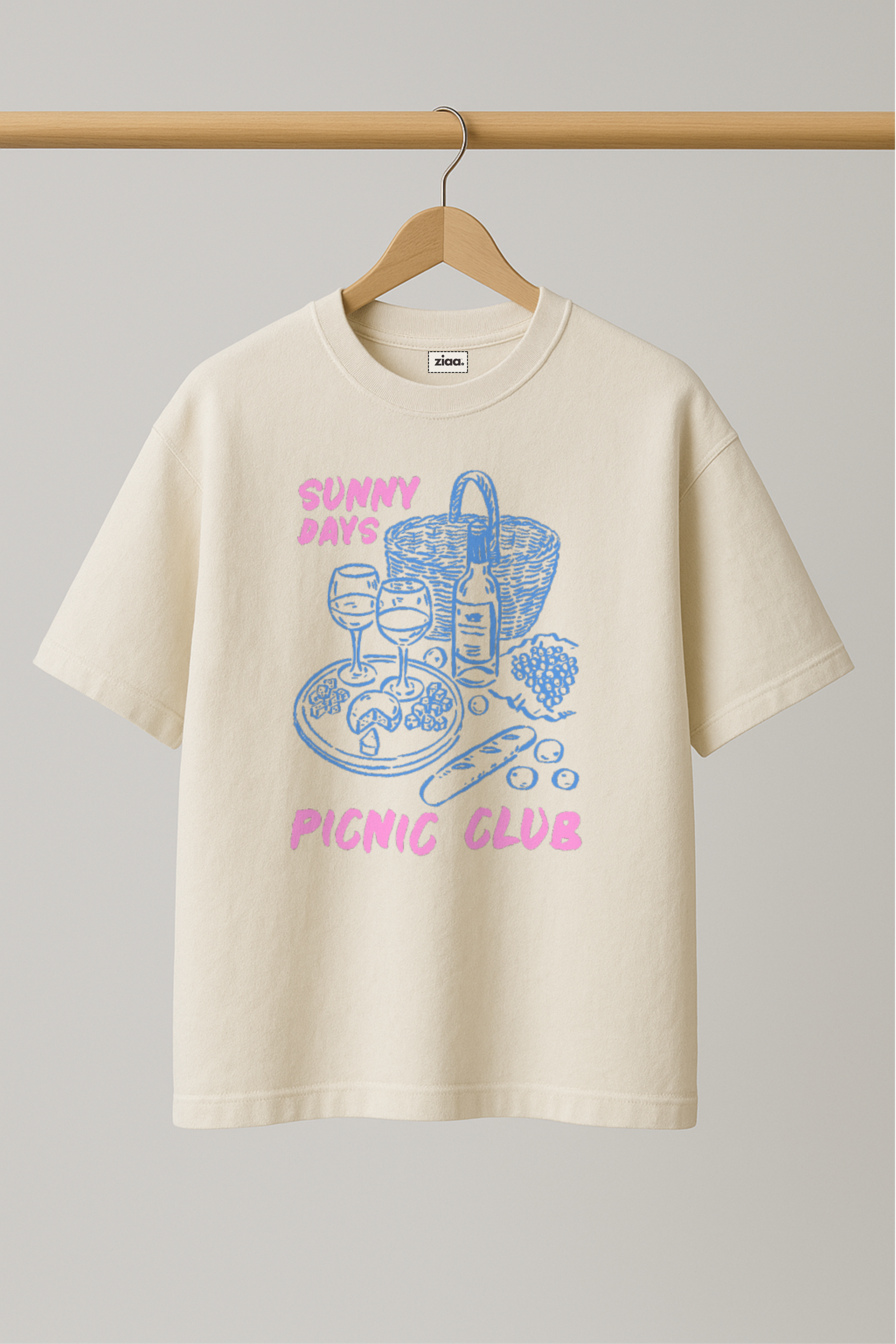 ZIAA "Sunny Days Picnic Club" graphic t-shirt with illustration of picnic items, white color base with pink and blue graphic